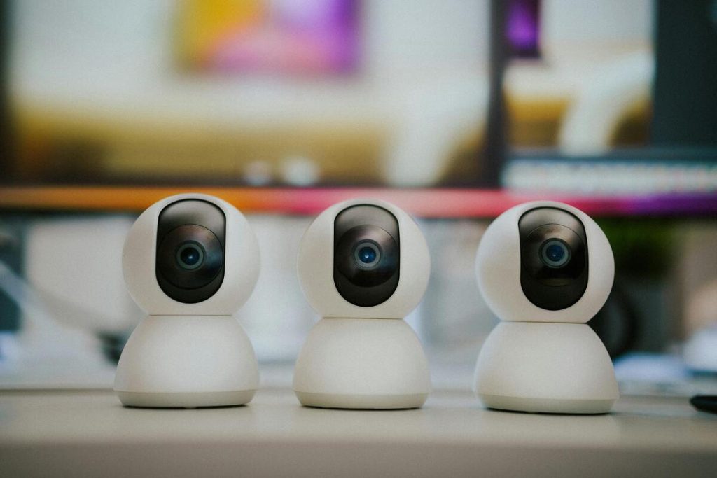 a group of white round objects with black eyes