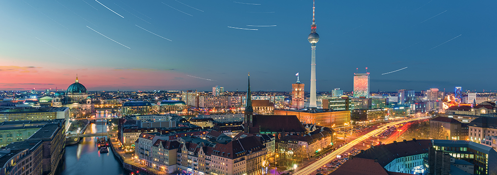 Night view of Berlin city lights with modern architecture and illuminated skyline