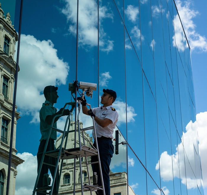 EuroTSI technician installing advanced security and network cabling systems at a commercial facility